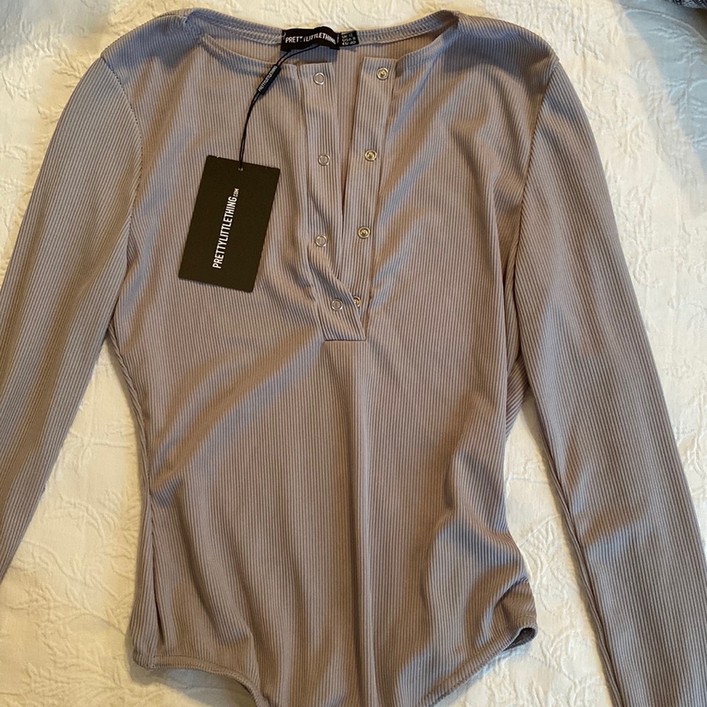 Grey Ribbed body suit. NWT.